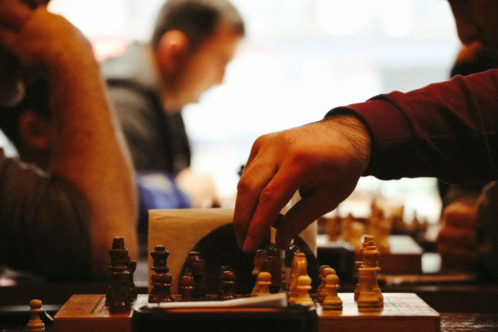 Players concentrating over a chess board