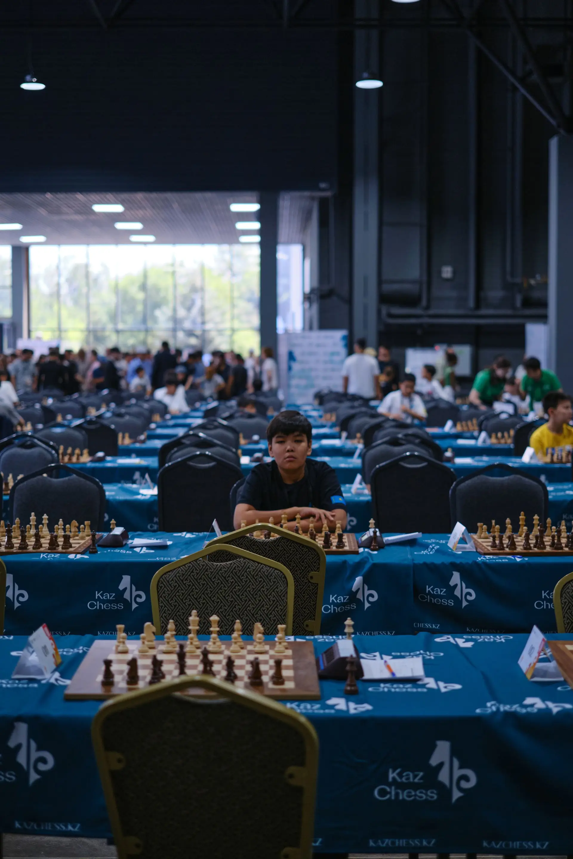 Chess tournament room with rows of boards