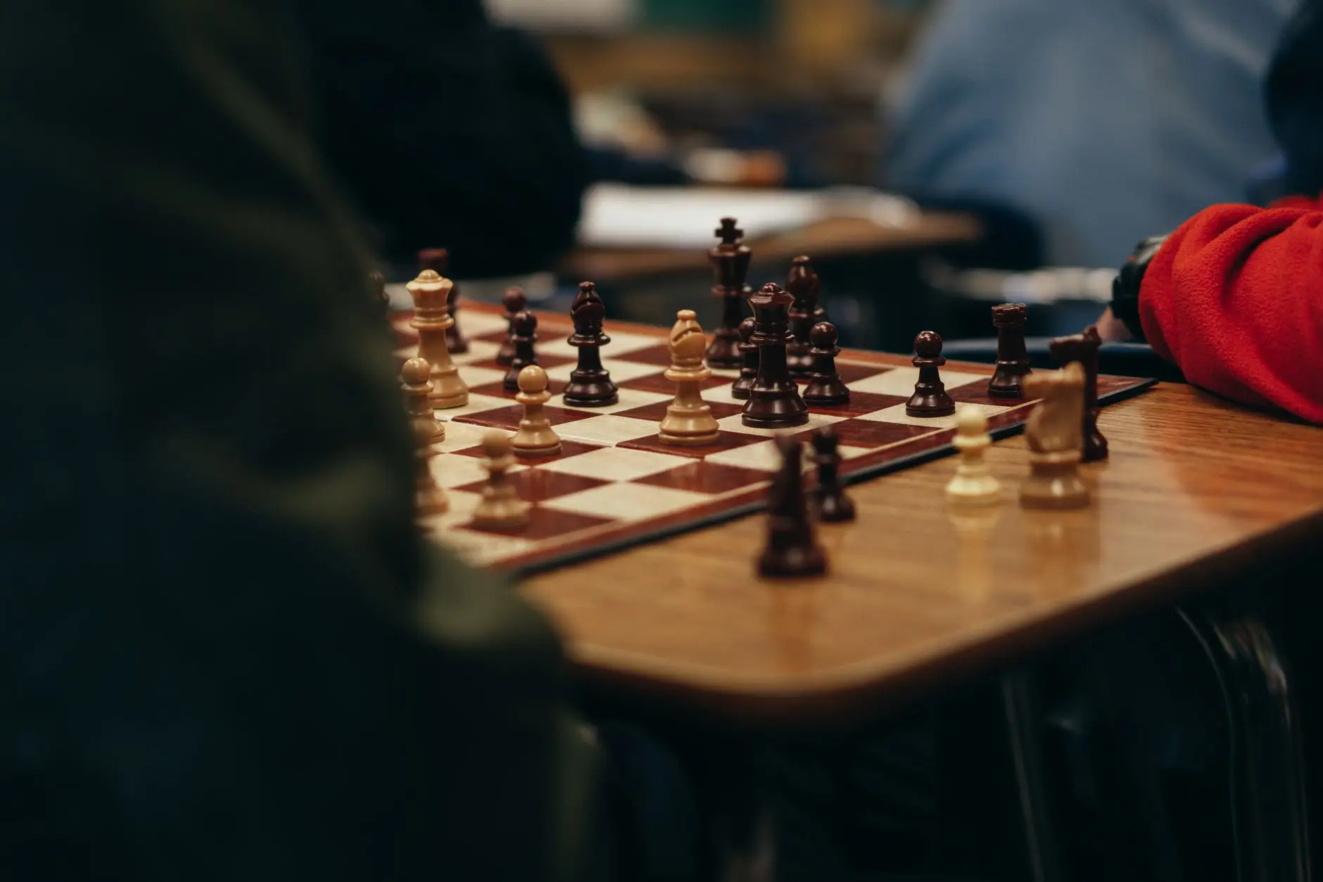 Two players in a focused club chess game