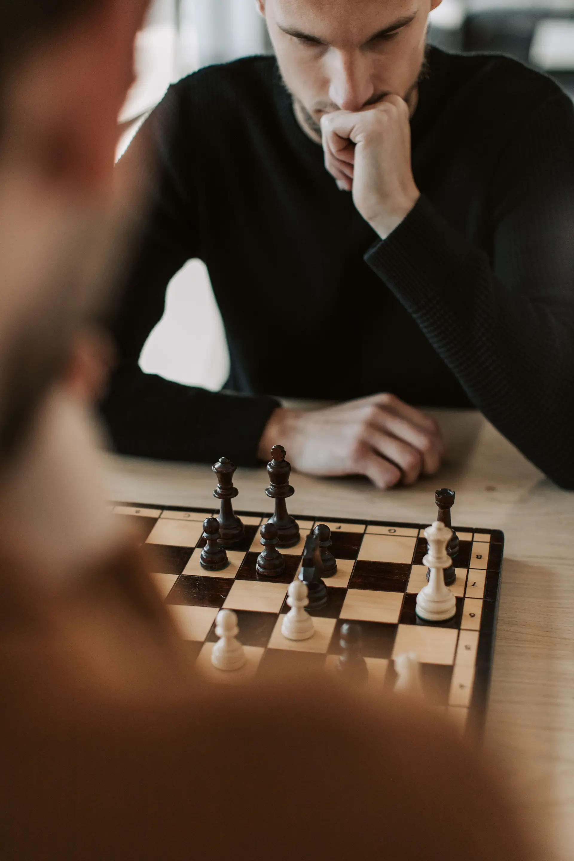 Chess player analysing a position