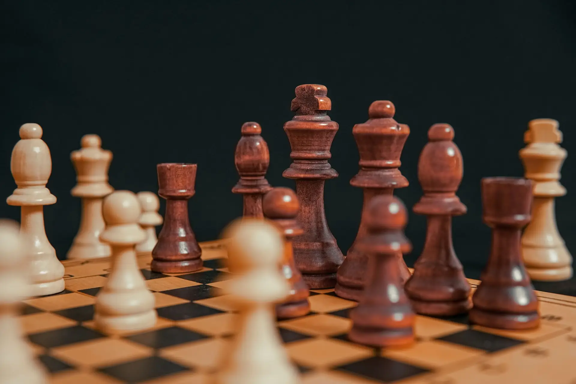 Wooden chess pieces on a board