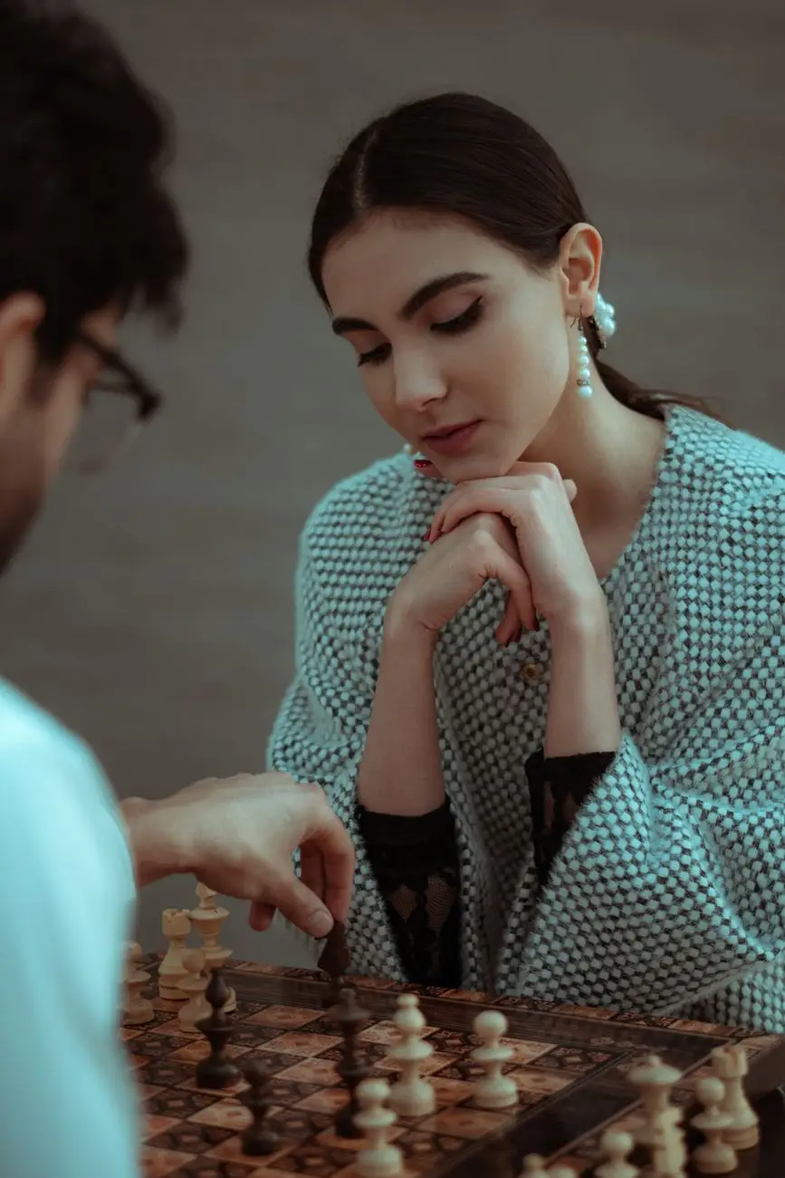 Chess players seated across the board
